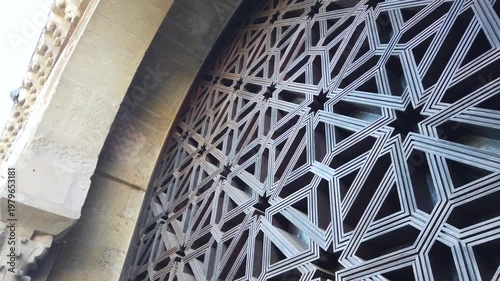 Islamic geometric wooden lattice arch in Cordoba mosque star pattern Spain
