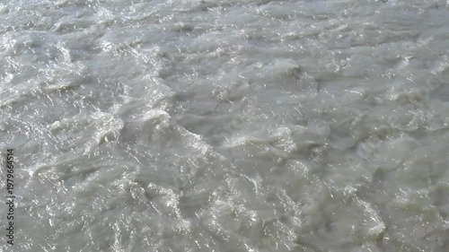 rapid water flow on the river surface, close-up, slow motion
