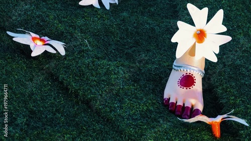 Close view of Goddess Durga feet decorated with harshingar flowers during Durga Puja in India