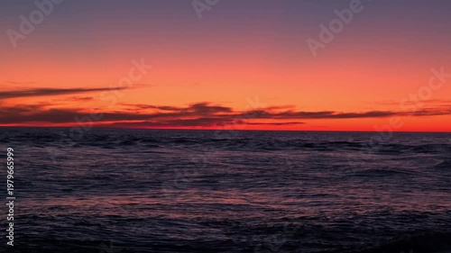 waves on surface of sea at sunset, slow motion
