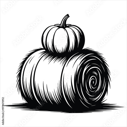 Black and white of a pumpkin resting on a round hay bale