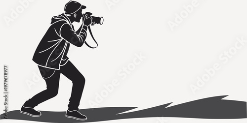Dynamic black and white silhouette illustration of a photographer in action crouching down and holding a professional camera with a long lens engaged in capturing images line art photography