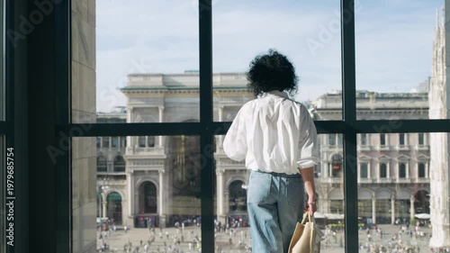 Woman Sightseeing Galleria Milan: Iconic City View from Window