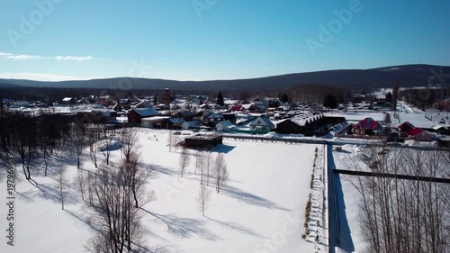 Flight over a winter village