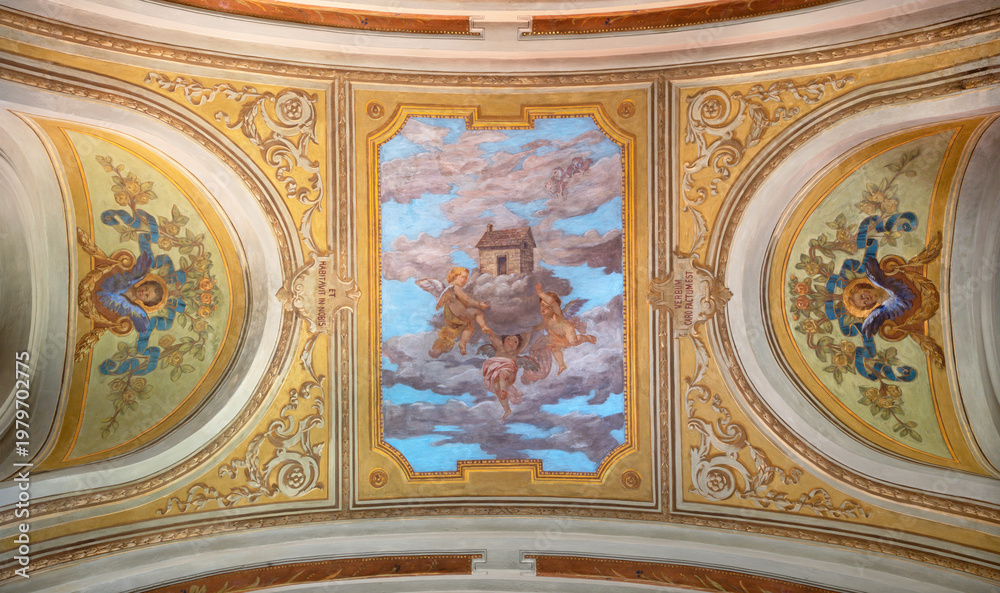 Fototapeta premium Ivrea - The ceiling fresco of angels with House of Nazareth in the church Chiesa di San Salvatore by G. Silvestro from end of 19. cent. 