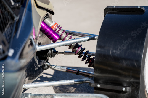 Obraz na płótnie High performance automotive suspension system featuring purple coilover shock ab