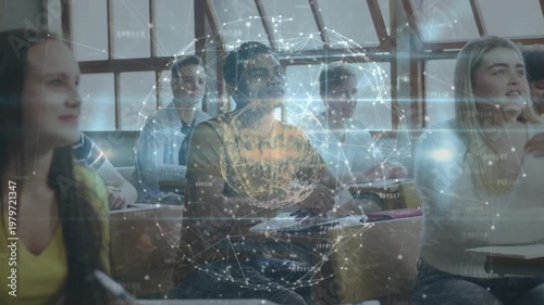 Students in classroom watching AR globe appearing rotating visualizing networks taking notes