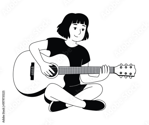 A person playing an acoustic guitar, sitting cross-legged