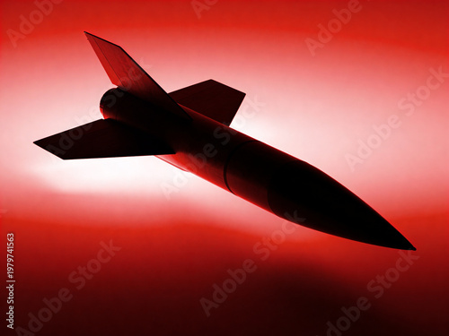 Abstract missile silhouette on dramatic gradient background