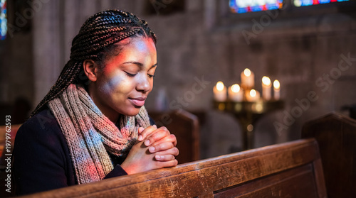 black woman praying in church pew candlelight faith worship devotion spirituality scene showing peaceful prayer beneath stained glass with candle glow for hope reflection and religious contemplation