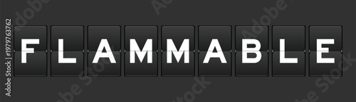 Black color analog flip board with word flammable on gray background