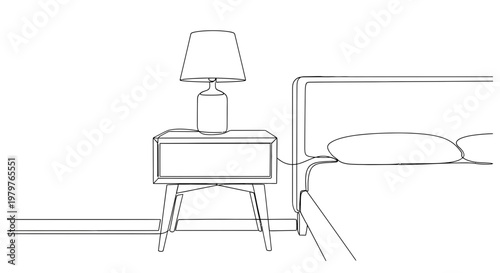 Modern bedside table with lamp.