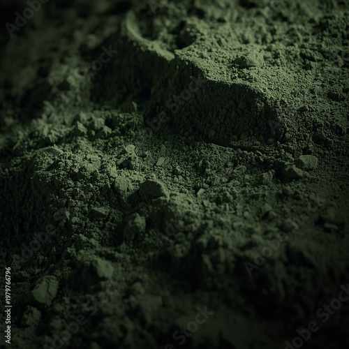 Dark green textured rocky landscape with rugged terrain and soil