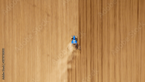 Aerial view of a lone blue tractor carving furrows in the vast, ochre earth, dust billowing behind like an earthbound cloud, Sremska Mitrovica, Vojvodina, Serbia.