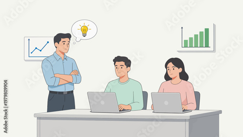 Three people working on laptops in an office