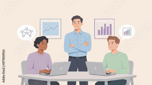 Three people working on laptops in office