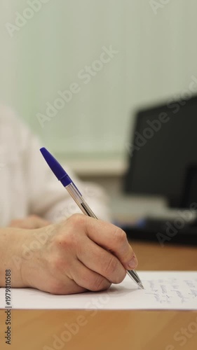 Doctor's appointment. Taking notes in a notebook. Slow motion. High quality 4k footage