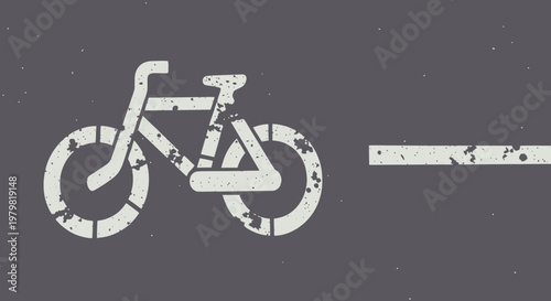 A distressed white bicycle symbol and a line on a dark grey background, indicating a bike lane or cycling path.