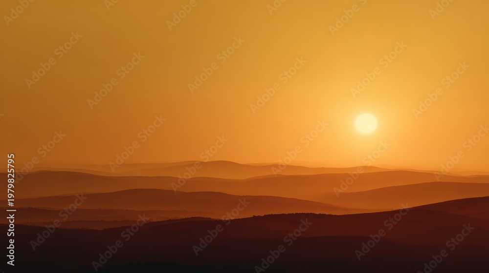 Obraz premium Sunset Over Rolling Hills with Warm Colors and Soft Light