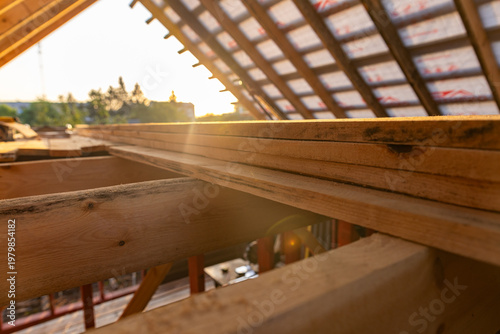Konstfotografi Under-construction residential wooden frame home located near a forest
