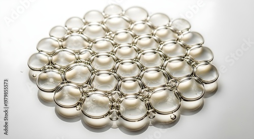 Perfectly Spherical Bubbles in a Delicate Honeycomb Pattern