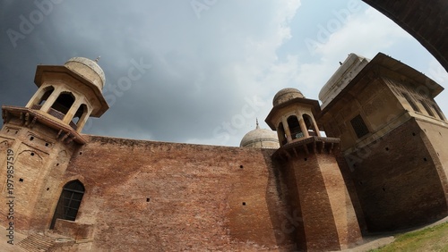 Historic Red Brick Rear Exterior Wall and Architectural Domes of Sheikh Chilli Tomb under Cloudy Rainy Weather in Kurukshetra