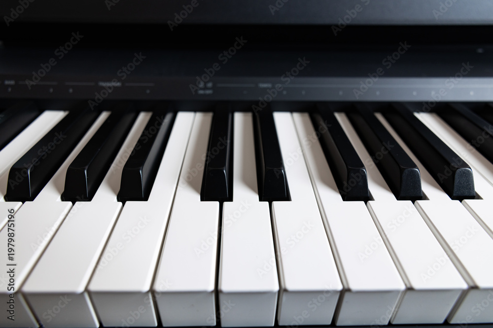 Fototapeta premium Macro shot of digital piano keys with shallow depth of field