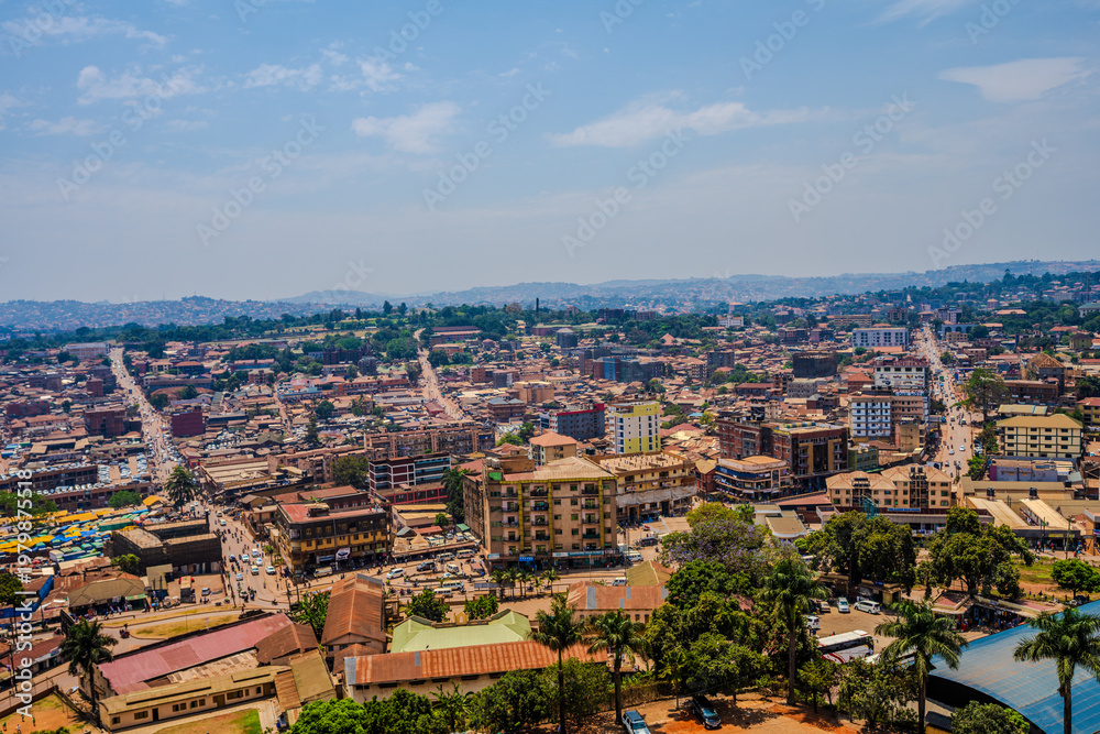 Fototapeta premium Elevated cityscape view over central Kampala with roads and low-rise buildings
