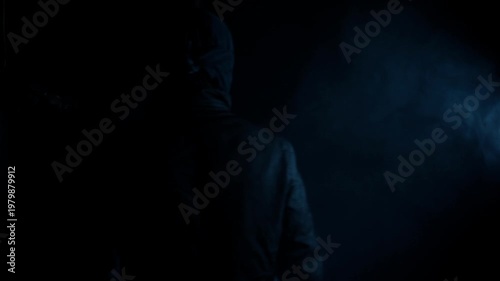 Anonymous Hooded Man Walking into Darkness, Mystery Crime Concept