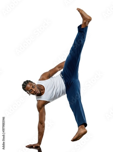 Man performing a challenging yoga or acrobatic pose.