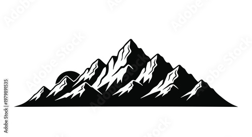 Mountain range silhouette captures the dramatic peaks of a rugged alpine landscape.