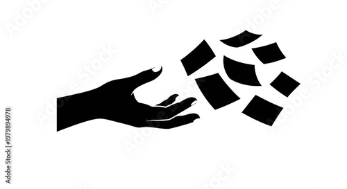 A hand releasing a collection of scattered black puzzle pieces into the air