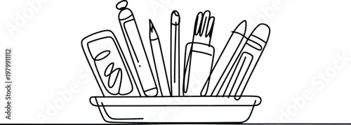 Desk organizer filled with various writing instruments and school supplies for office work and study sessions