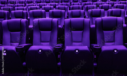 Картината върху платно Rows of empty purple cinema seats in modern movie theater