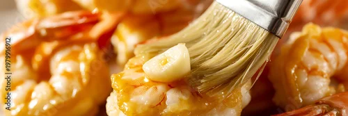 Obraz  z motywem A culinary brush applies a glistening glaze to succulent shrimp with a slice of garlic