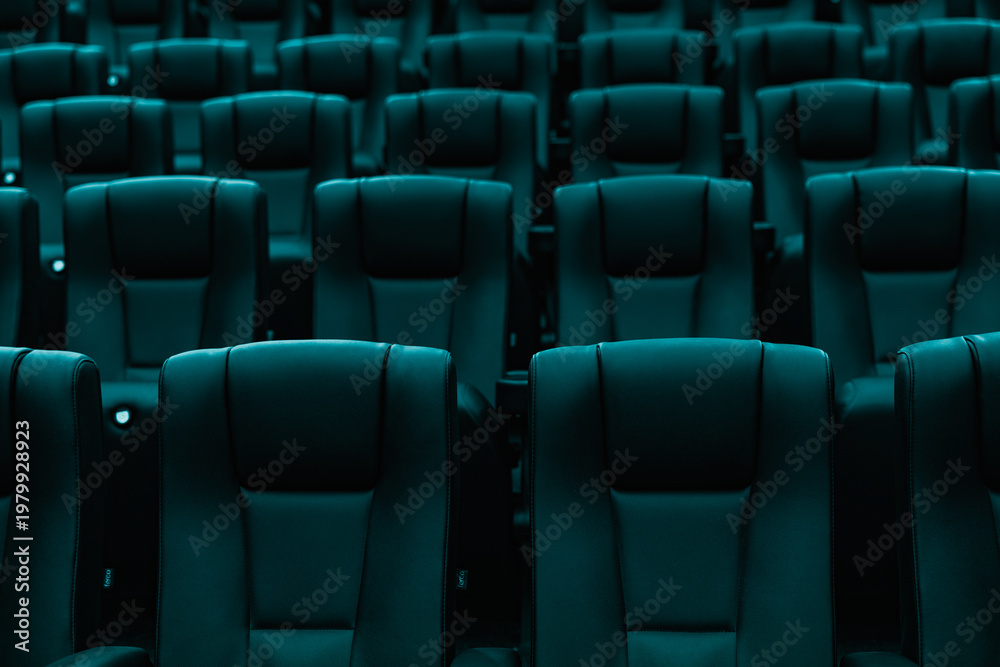 Fototapeta premium Rows of empty turquoise cinema seats in modern movie theater