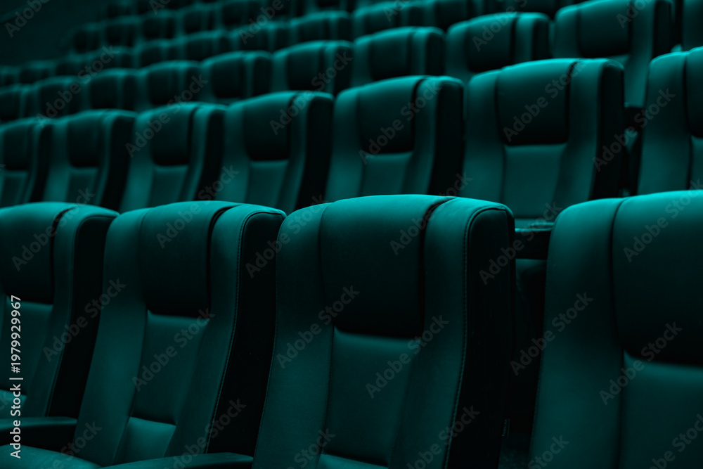 Obraz premium Rows of empty turquoise cinema seats in modern movie theater