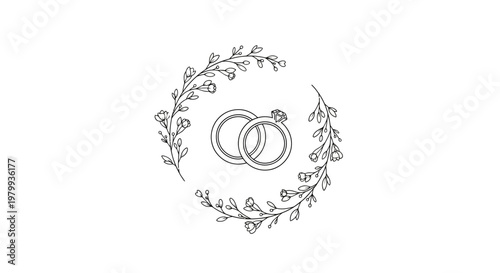 Interlocking wedding rings with floral wreath.
