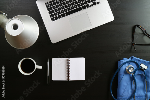 Modern Medical Workspace with Laptop, Coffee and Stethoscope