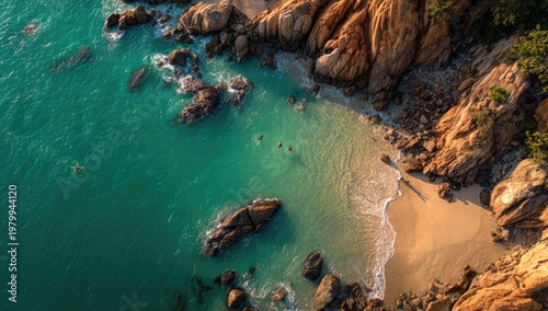 Aerial View of a Tropical Beach with Turquoise Water and Rocky Coastline.