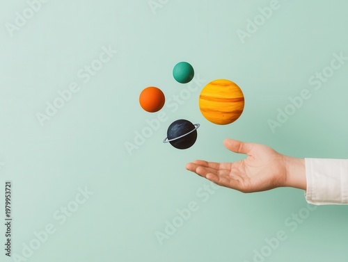 Wallpaper Mural Giant hand painting solar system in midair, creator or designer visual metaphor Torontodigital.ca
