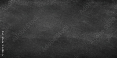 Fotografie A dark vintage chalkboard background featuring a rough black leather texture and