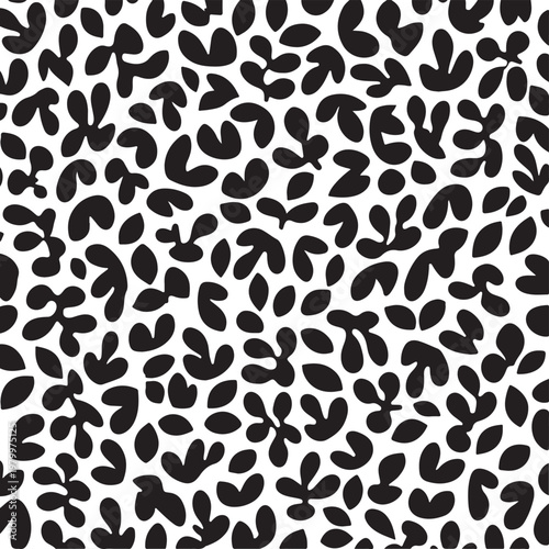 Abstract pattern composed of scattered black leaf shapes on a white background Vector