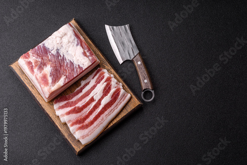 Bild auf Leinwand Raw fresh bacon slices with layers of meat or prosciutto prepared for frying