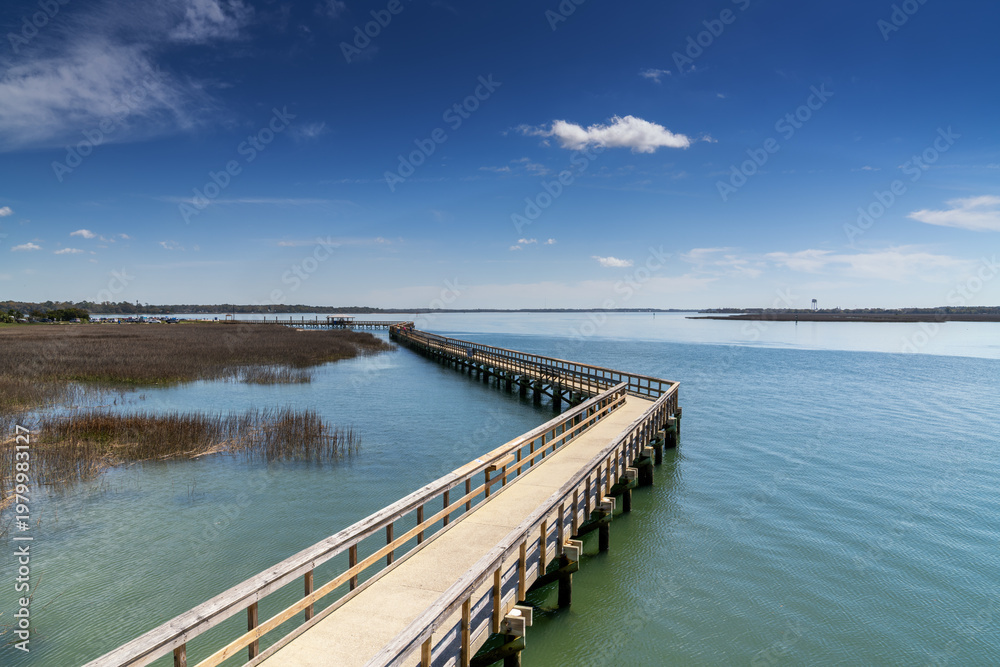 Fototapeta premium view of the boardwalk and Battery Creek at Sands Beach in Port Royal