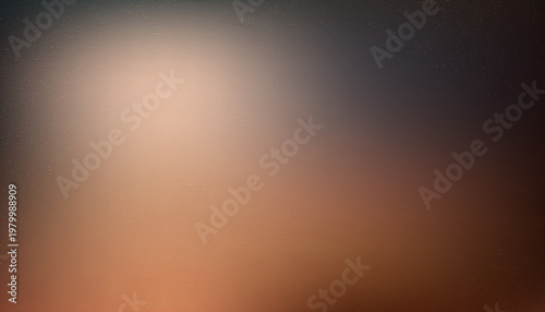 An abstract blurred image dominated by gradients of brown orange and gray tones suggests a soft indistinct background