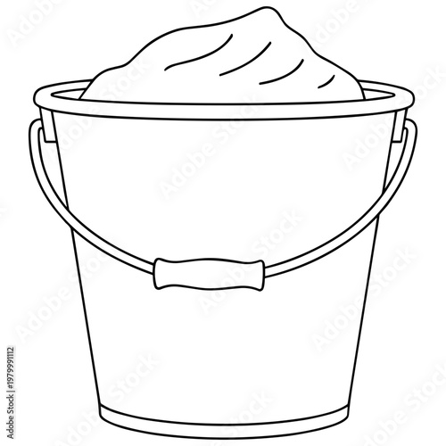 A large bucket filled with sand on a sunny day outdoors