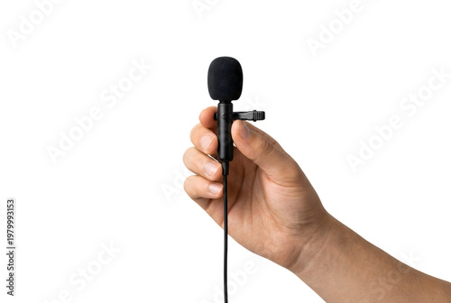 Hand holding a small clip-on lavalier or lapel microphone. Isolated on transparent background, png