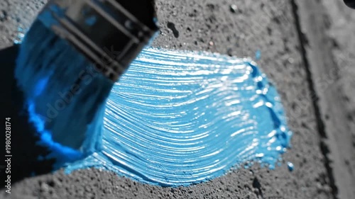 Painting with a Brush on a Wooden Surface