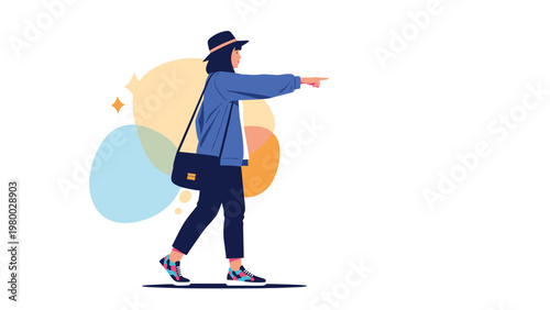 Stylish woman wearing a blue jacket and hat walking confidently and pointing forward toward her next destination.